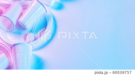 Disposable plastic tableware on a light background in pastel colors. Minimalistic ecologically clean still life. Pop Art. And ecology problem concept. 60039757