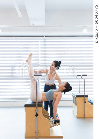 Healthy life, exercising pilates using pilates device 183 60040775