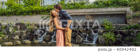 Young couple in love spends their honeymoon in Seoul. Cheonggyecheon stream in Seoul, Korea 60042402
