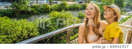 Mom and son tourists in Cheonggyecheon stream in Seoul, Korea. Cheonggyecheon stream is the result 60042437