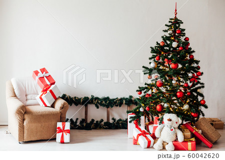 Christmas decor house Christmas tree with gifts for the new year as a background Christmas decor house Christmas tree with gifts for the new year as a background 60042620