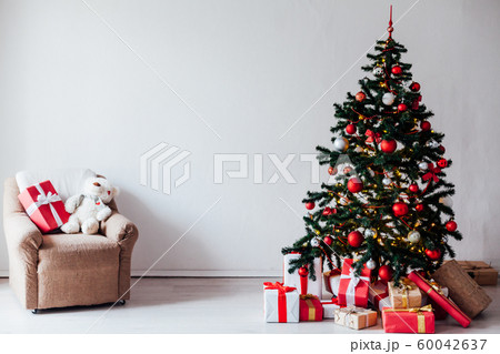 Christmas decor house Christmas tree with gifts for the new year as a background Christmas decor house Christmas tree with gifts for the new year as a background 60042637