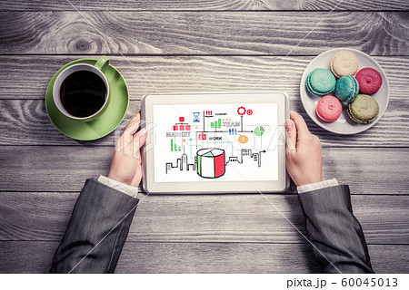 Businesswoman and her business notes Businesswoman and her business notes 60045013