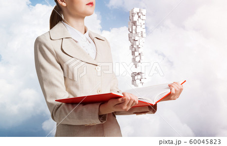 Attractive woman holding open notebook 60045823