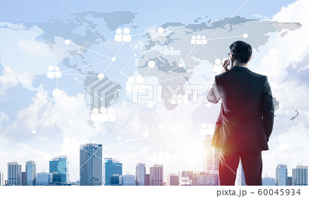 Concept of business success and control with confident boss against cityscape background 60045934