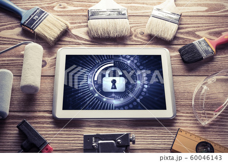 Web security and technology concept with tablet pc on wooden table 60046143