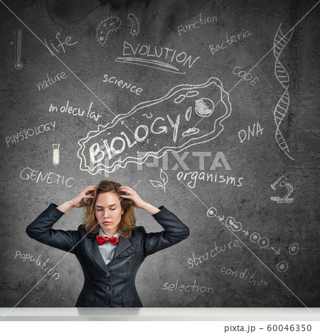 Stressed teacher in classroom Stressed teacher in classroom 60046350