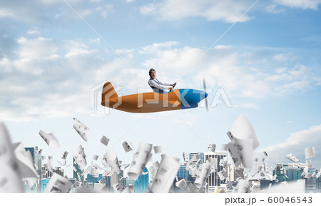 Satisfied emotional pilot sitting in airplane Satisfied emotional pilot sitting in airplane 60046543