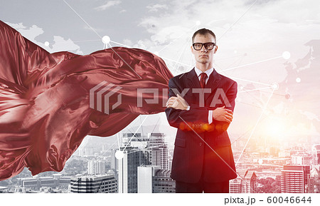 Concept of power and sucess with businessman superhero in big city 60046644