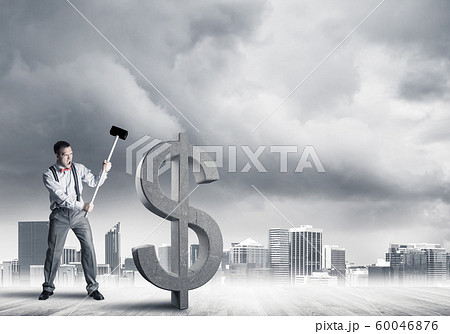 Determined banker man against modern cityscape breaking dollar concrete figure 60046876