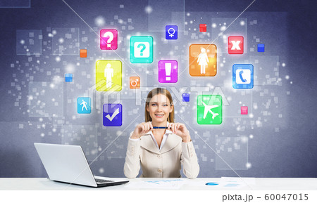 Woman working at table 60047015