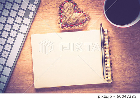 Blank notepad on wooden table Blank notepad on wooden table 60047235