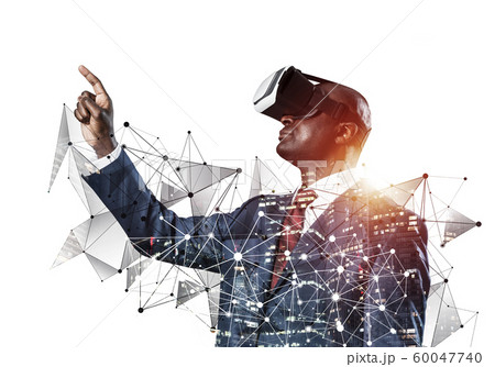 Black man standing with VR headset Black man standing with VR headset 60047740