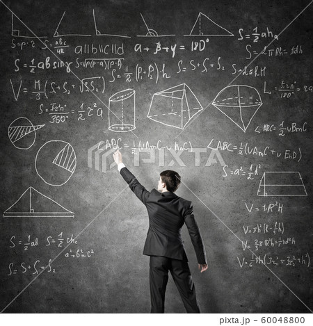 Man writing on blackboard 60048800
