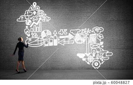 Woman throwing light on her ideas Woman throwing light on her ideas 60048827