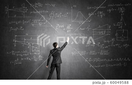 Man writing on blackboard Man writing on blackboard 60049588