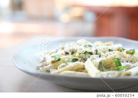 Penne pasta with white sauce and truffle , italian food 60050254
