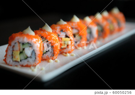 california roll sushi , rice roll with egg avocado egg and fish japanese food 60050256