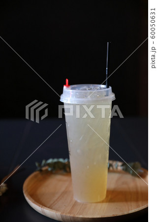 Lemon juice in black background Lemon juice in black background 60050631