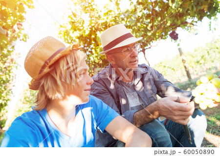 Two generations of vintners outdoor together Two generations of vintners outdoor together 60050890