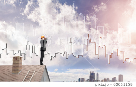 Engineer man standing on roof and looking in binoculars. Mixed media 60051159