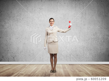 Woman keep at distance vintage red phone 60051209