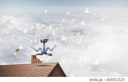 Concept of security and privacy protection with camera headed man meditating 60051223