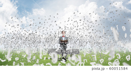 Young businessman or student studying the science and symbols fly around Young businessman or student studying the science and symbols fly around 60051584