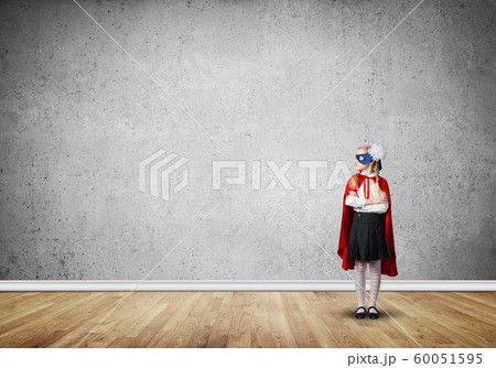Girl power concept with cute kid guardian in empty room. Mixed media Girl power concept with cute kid guardian in empty room. Mixed media 60051595