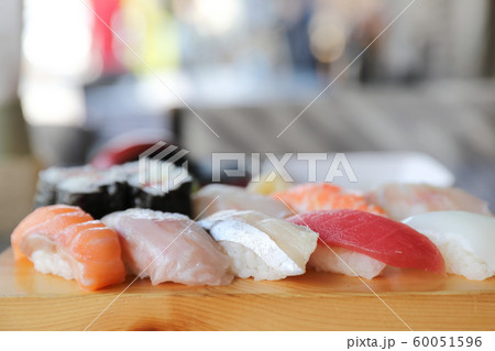 Sushi Set nigiri and sushi maki with tea served on wood and soup , Japanese food Sushi Set nigiri and sushi maki with tea served on wood and soup , Japanese food 60051596