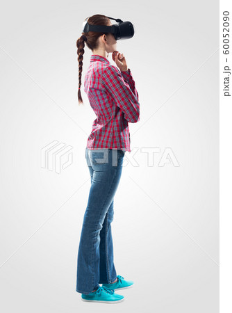 Young woman wearing virtual helmet Young woman wearing virtual helmet 60052090