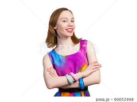 Joyful caucasian woman standing with folded arms Joyful caucasian woman standing with folded arms 60052998