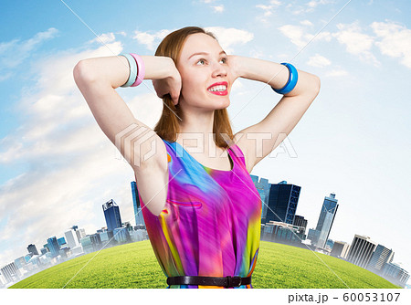 Redhead caucasian girl with closed ears looking up Redhead caucasian girl with closed ears looking up 60053107