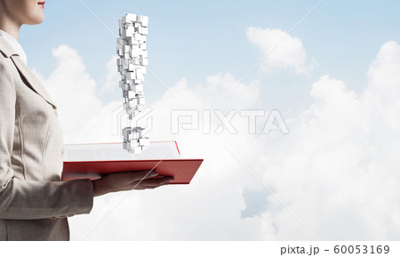 Attractive woman holding open notebook 60053169