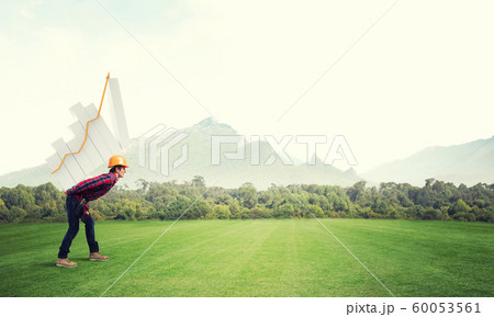 Engineer man carry progress graph Engineer man carry progress graph 60053561