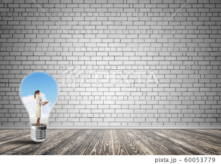 Businesswoman trapped in bulb 60053779