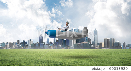 Businessman in aviator hat and goggles Businessman in aviator hat and goggles 60053929