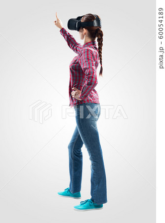 Lady using virtual reality glasses Lady using virtual reality glasses 60054189