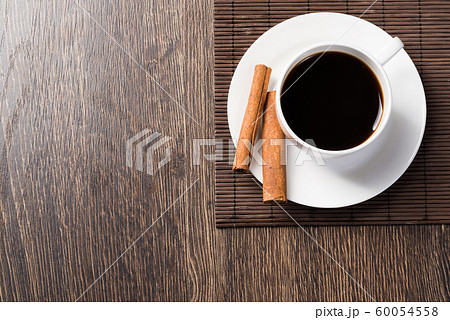 Cup of black coffee on wooden table Cup of black coffee on wooden table 60054558