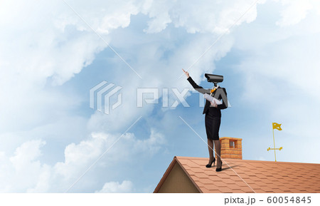 Concept of security and privacy protection with camera headed woman 60054845