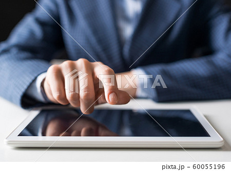 Male hand touching screen of digital tablet 60055196