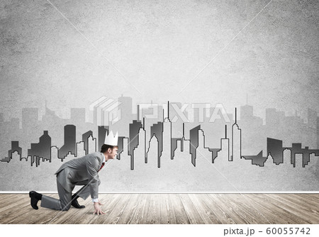 King businessman in elegant suit running and drawn cityscape silhouette at background 60055742