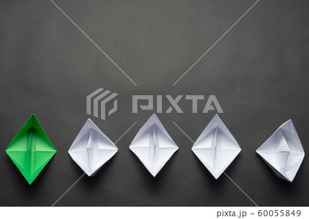 Row of paper ships on black background Row of paper ships on black background 60055849