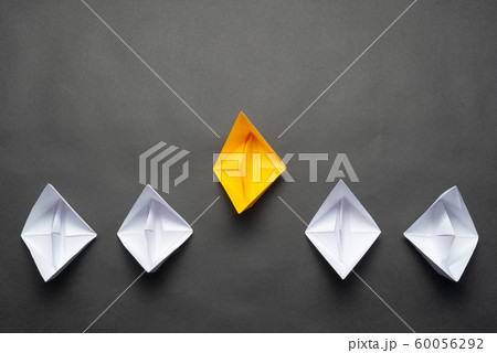 Row of paper ships on black background Row of paper ships on black background 60056292