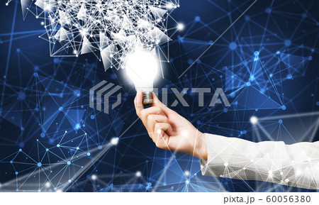 Human hand with glowing lamp and abstract network Human hand with glowing lamp and abstract network 60056380