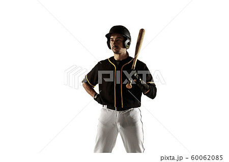 Baseball player, pitcher in a black uniform practicing on a white background. Baseball player, pitcher in a black uniform practicing on a white background. 60062085