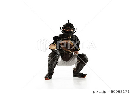 Baseball player, pitcher in a black uniform practicing on a white background. Baseball player, pitcher in a black uniform practicing on a white background. 60062171
