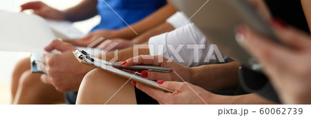 Group of people hold silver pen 60062739