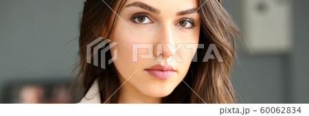 Beautiful smiling girl at workplace look in camera Beautiful smiling girl at workplace look in camera 60062834