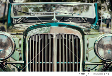 headlights and radiator of green old retro car headlights and radiator of green old retro car 60066374